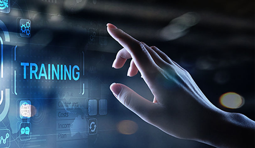 Image of a hand pointing to a digital display that allows her to select Training as an option